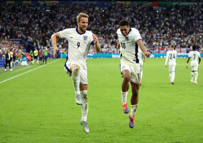 GELSENKIRCHEN, GERMANY - JUNE 30: Harry Kane of England celebrates scoring his team's second goal with teammate Jude Bellingham during the UEFA EURO 2024 round of 16 match between England and Slovakia at Arena AufSchalke on June 30, 2024 in Gelsenkirchen, Germany. (Photo by Carl Recine/Getty Images)
